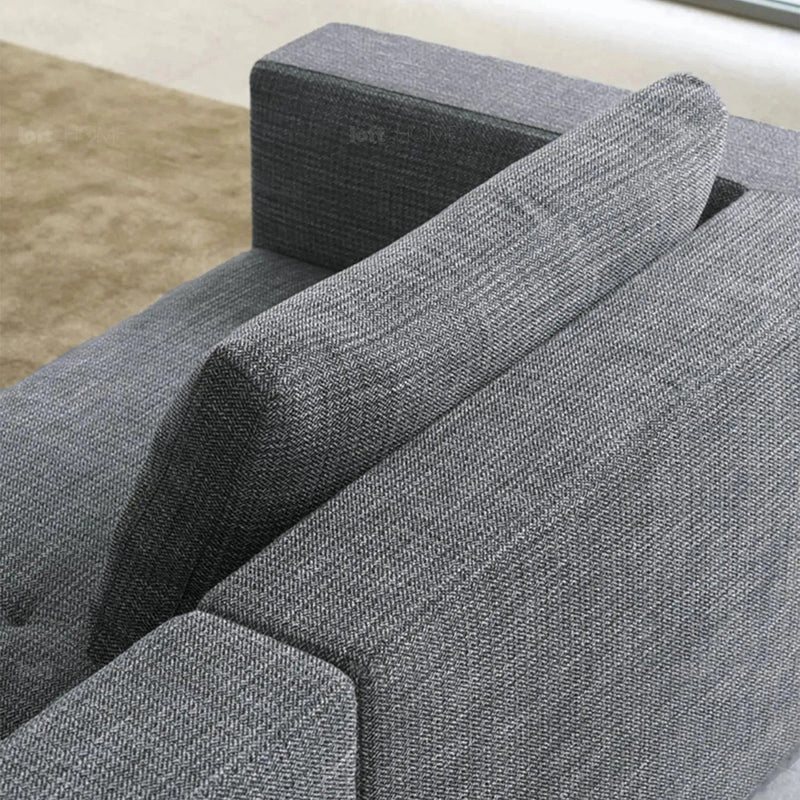 Minimalist fabric 4.5 seater sofa bri in still life.