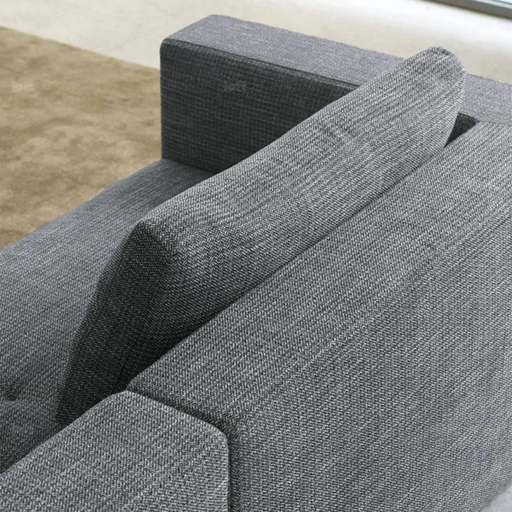 Minimalist fabric 4.5 seater sofa bri in still life.