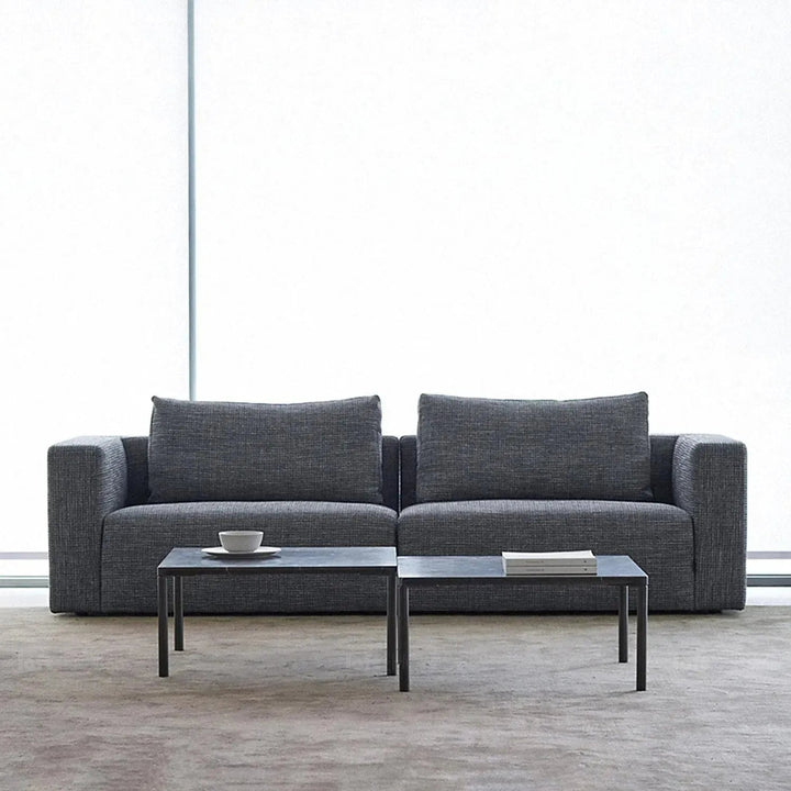 Minimalist fabric 4.5 seater sofa bri in close up details.