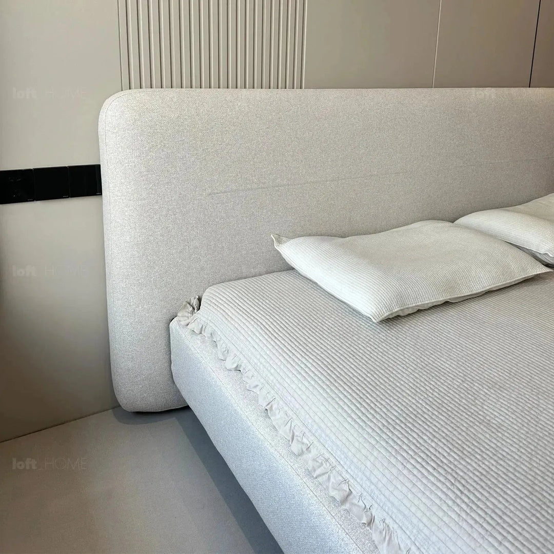 Minimalist fabric bed hel in still life.
