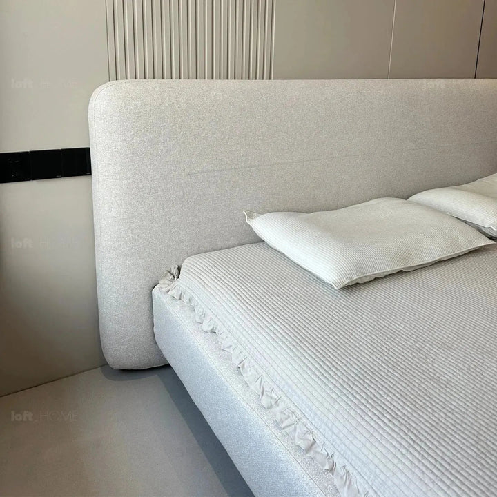 Minimalist fabric bed hel in still life.