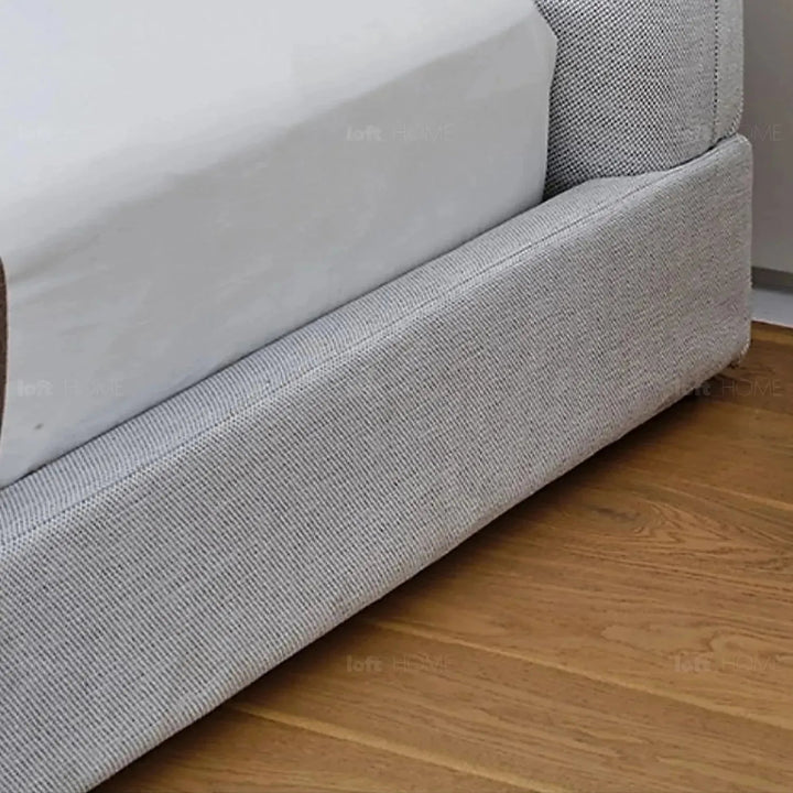Minimalist fabric bed lines layered structure.