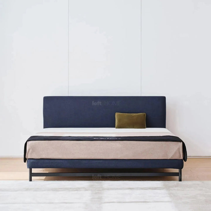Minimalist fabric bed nor in panoramic view.