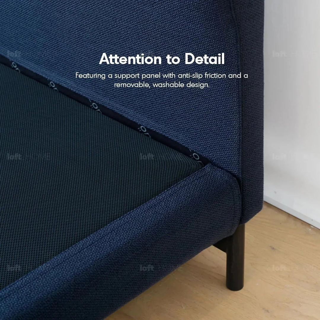 Minimalist fabric bed nor in details.