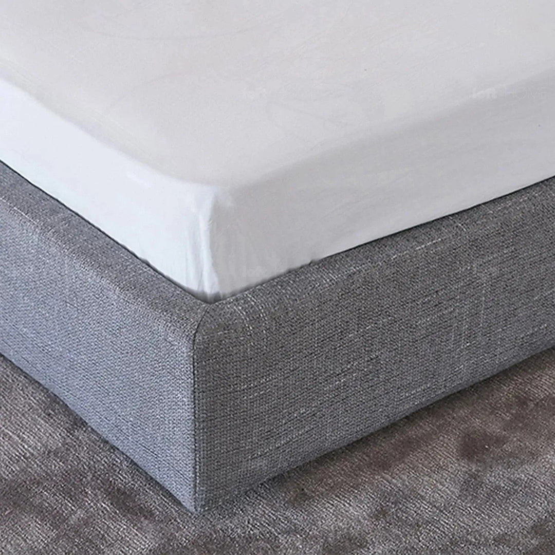 Minimalist fabric bed vaselli in close up details.