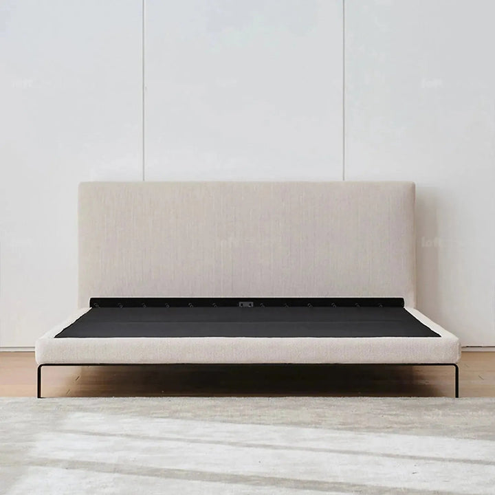 Minimalist fabric bed vem in still life.