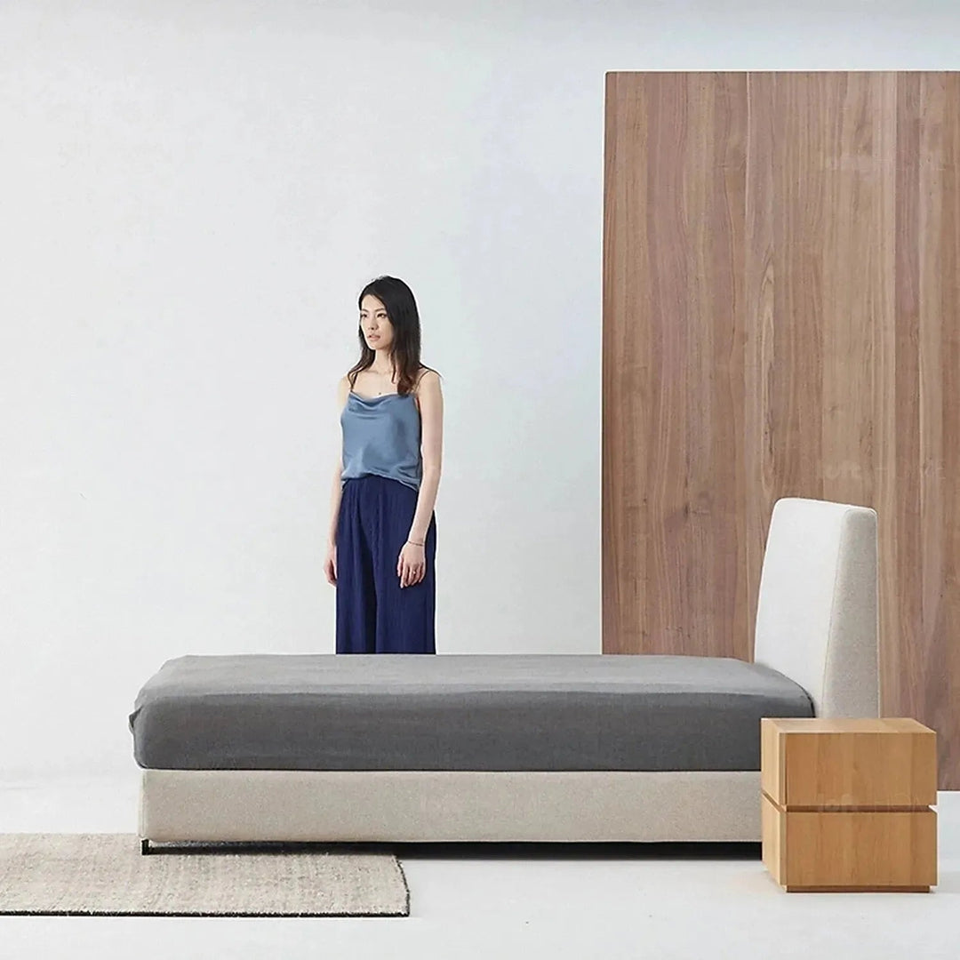 Minimalist fabric bed woods in panoramic view.