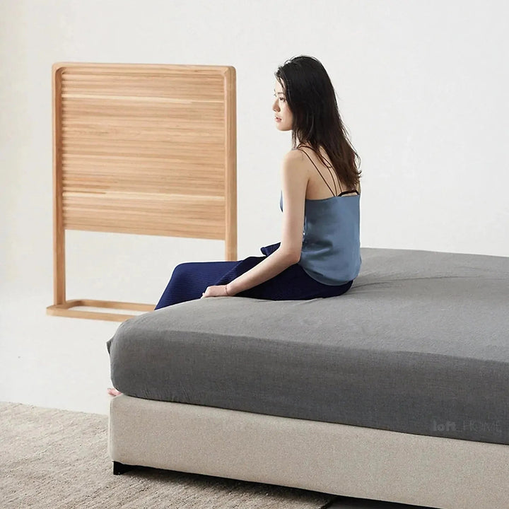 Minimalist fabric bed woods conceptual design.