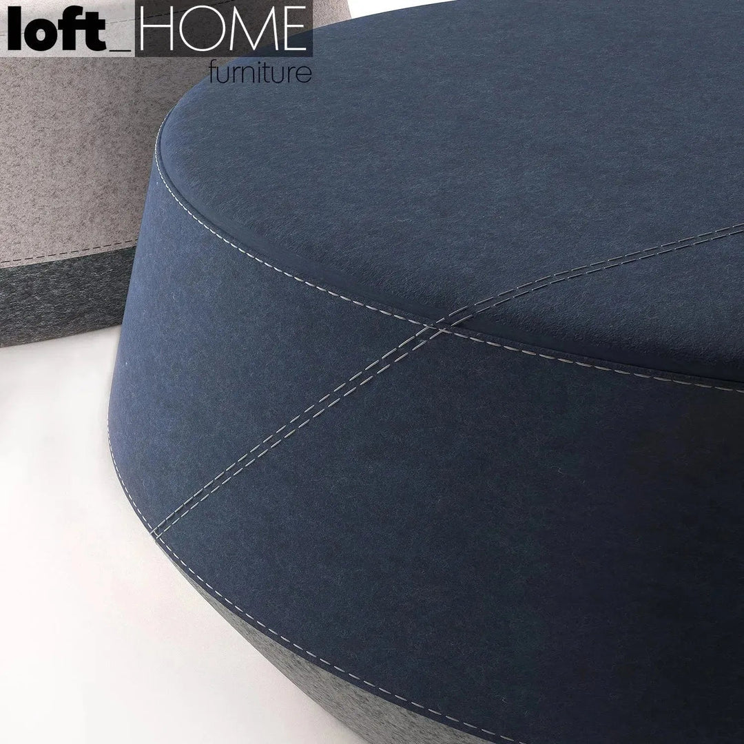 Modern fabric ottoman buono with context.