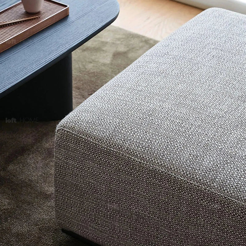 Minimalist fabric ottoman nemo in panoramic view.