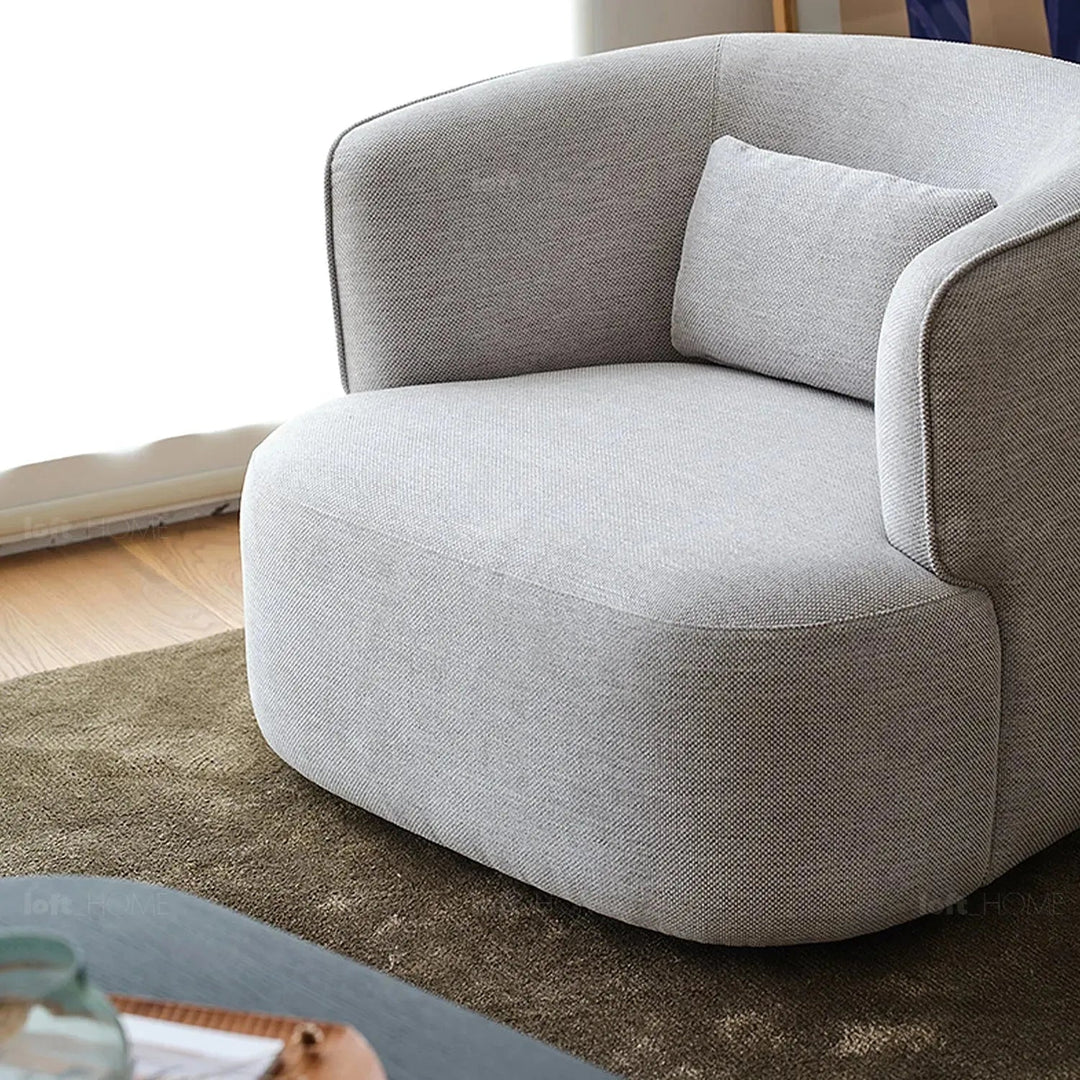 Minimalist fabric revolving 1 seater sofa heb in details.