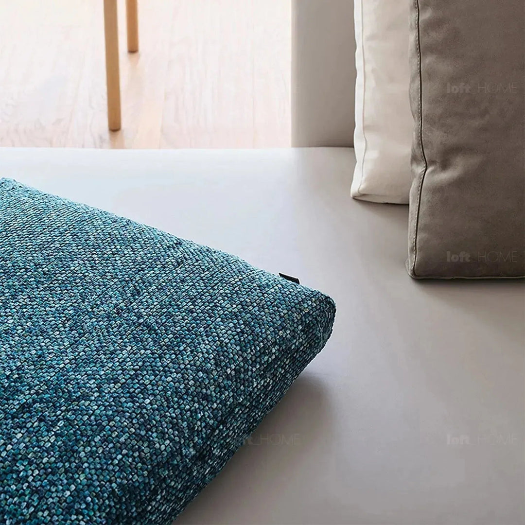 Modern fabric sofa pillow winter blue in close up details.