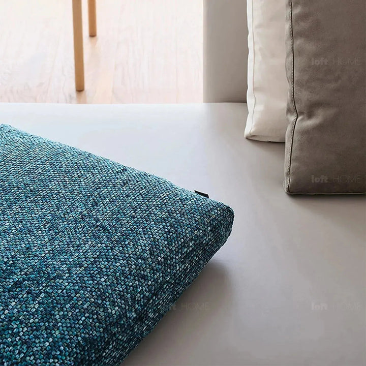 Modern fabric sofa pillow winter blue in close up details.