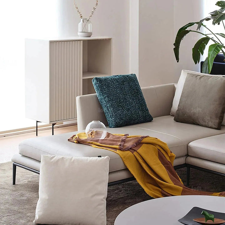 Modern fabric sofa pillow winter blue in real life style.