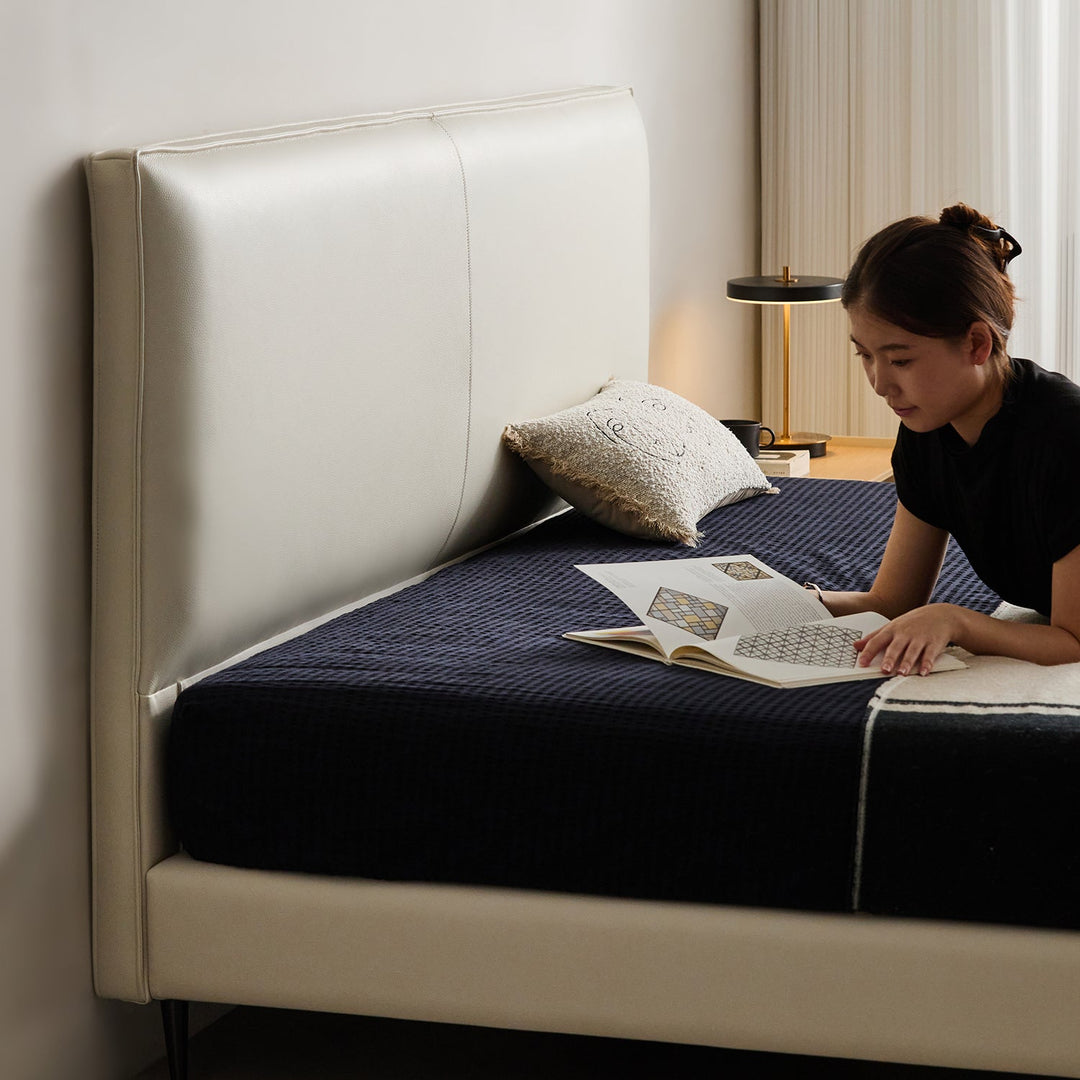 Minimalist genuine leather bed lalo with context.