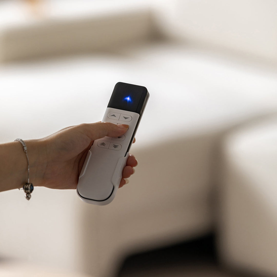 Minimalist genuine leather electric recliner 4 seater sofa bed string in still life.