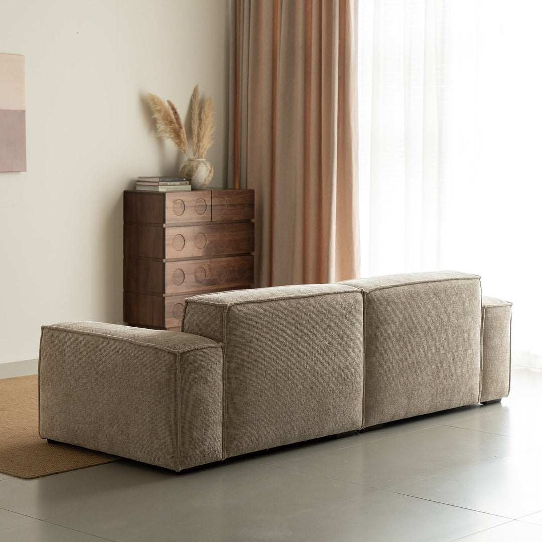 Minimalist linen fabric 4 seater sofa camaleonda in still life.