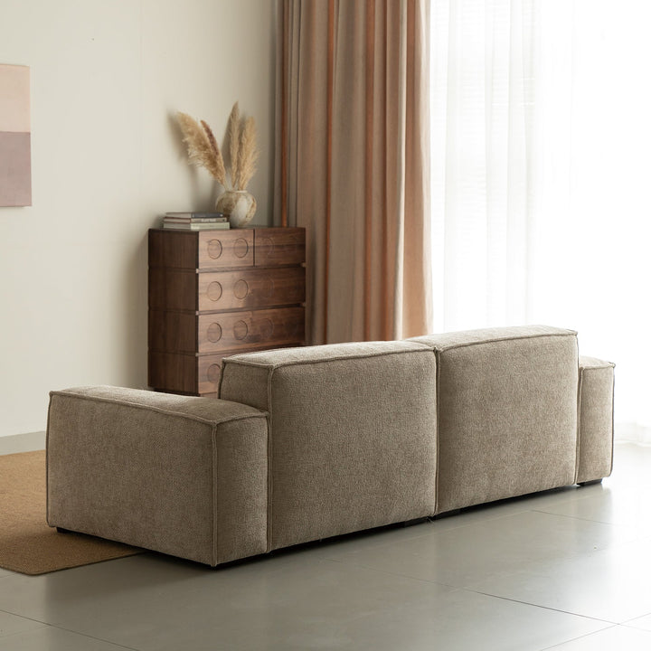 Minimalist linen fabric 4 seater sofa camaleonda in still life.
