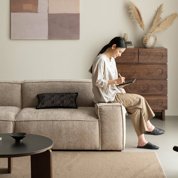 Minimalist linen fabric 4 seater sofa camaleonda in close up details.