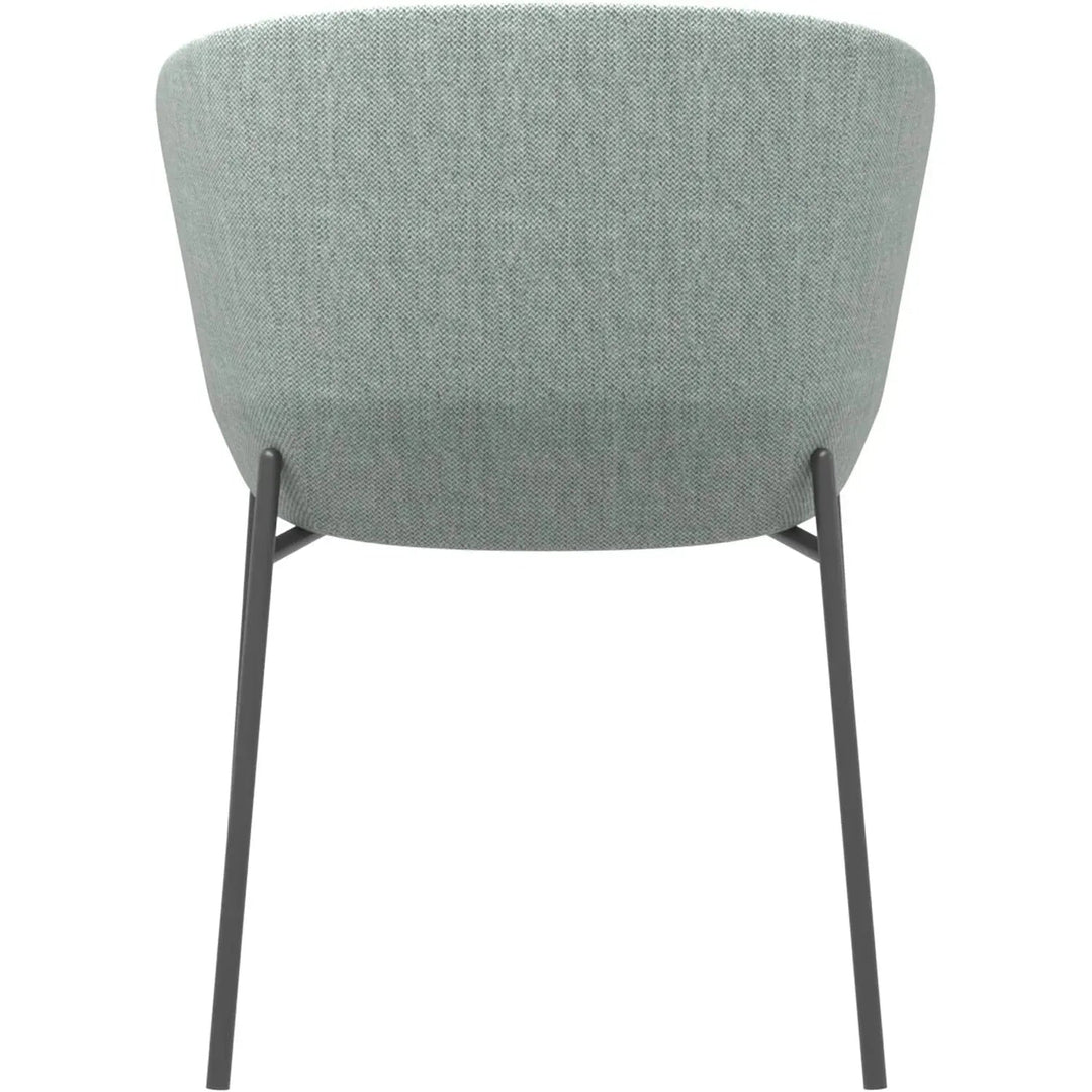Industrial metal fabric dining chair slicing in still life.