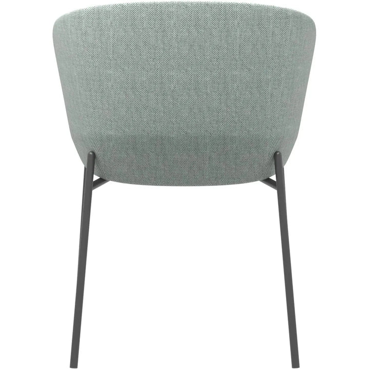 Industrial metal fabric dining chair slicing in still life.