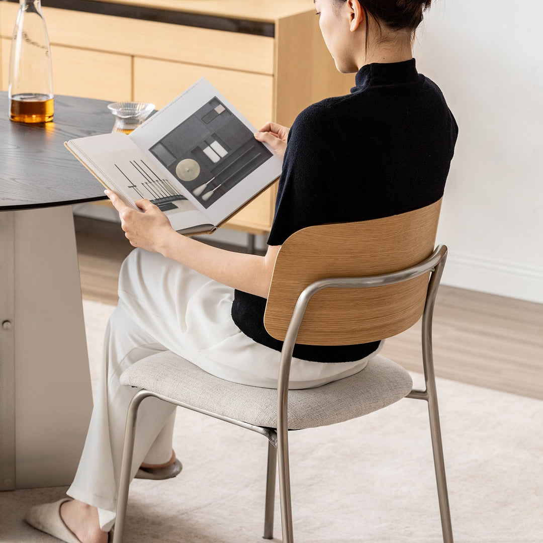 Minimalist ash wood veneer cotton fabric dining chair aeri in real life style.