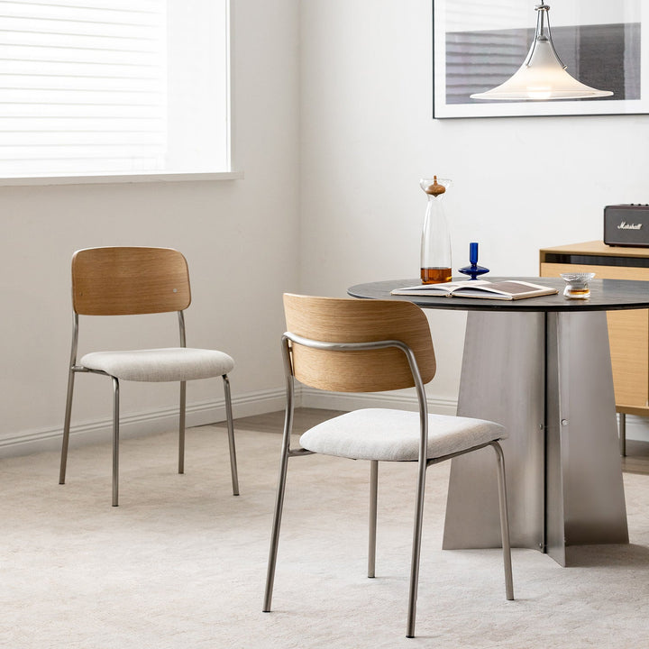 Minimalist ash wood veneer cotton fabric dining chair aeri in panoramic view.