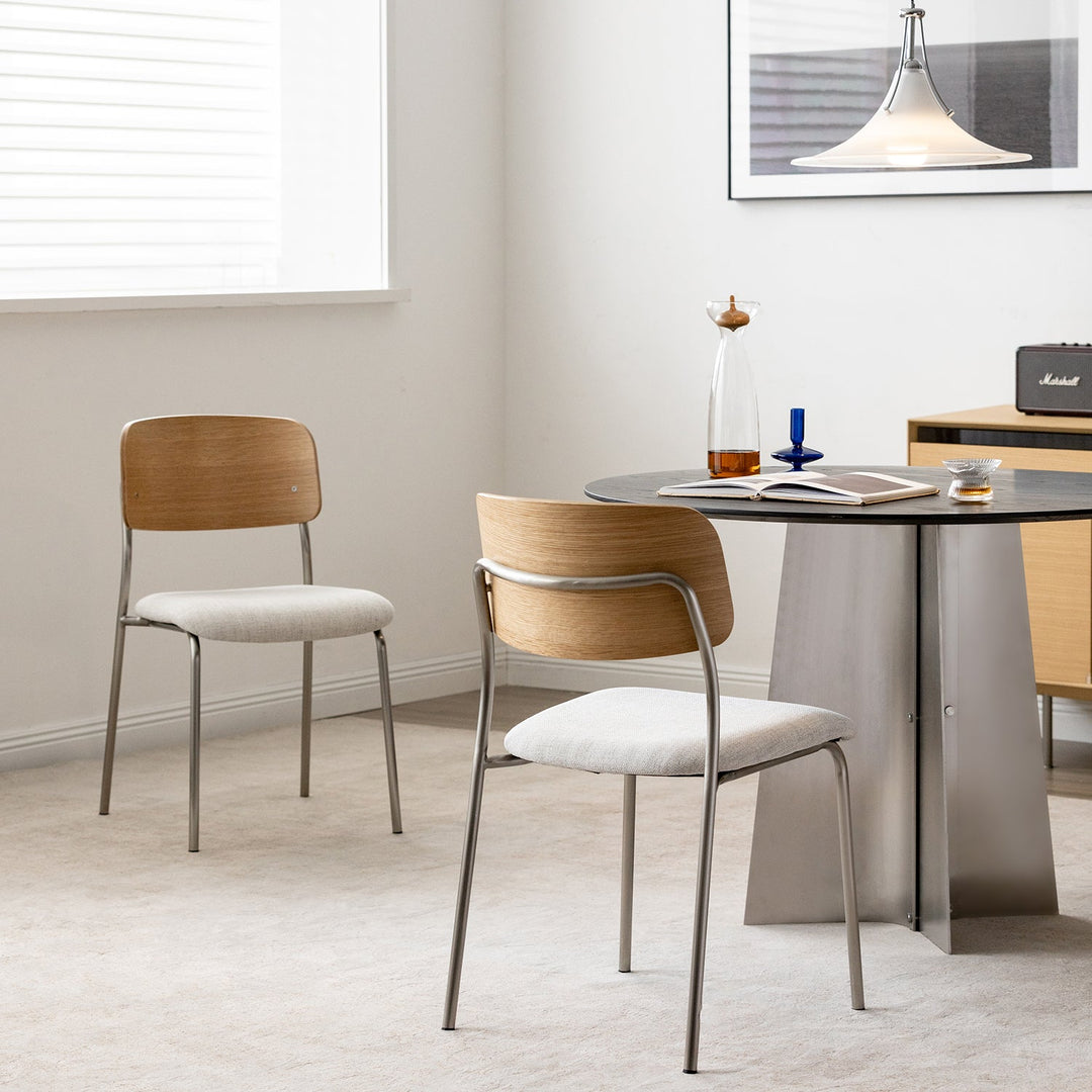 Bauhaus ash wood veneer cotton fabric dining chair aeri in panoramic view.