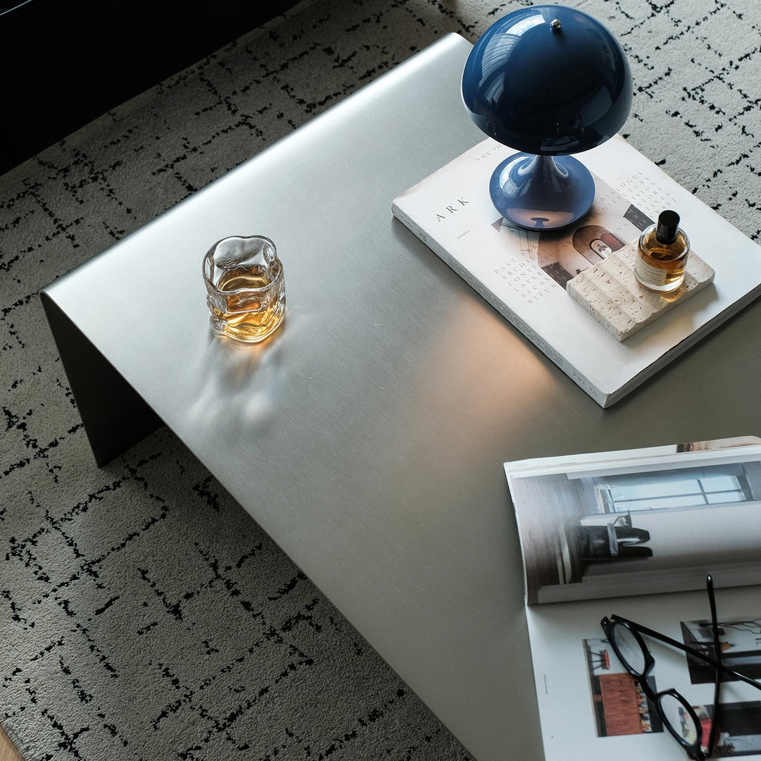 Bauhaus steel coffee table arc material variants.