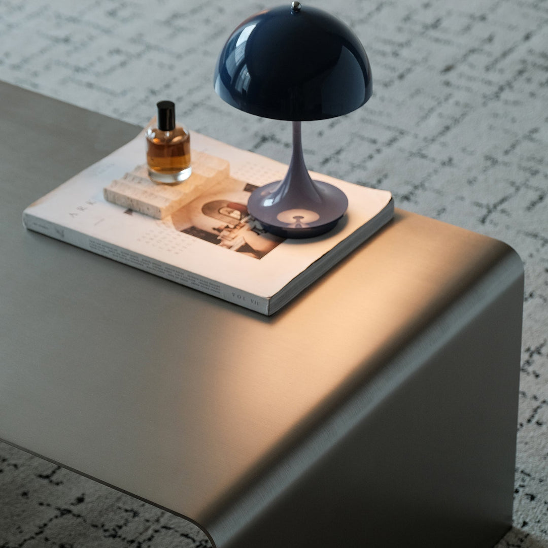 Minimalist steel coffee table arc in details.