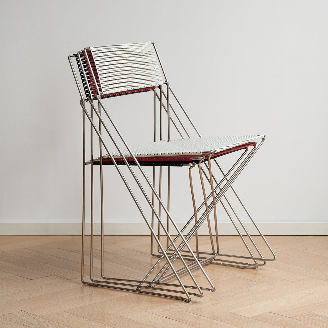 Minimalist steel dining chair x-line in details.