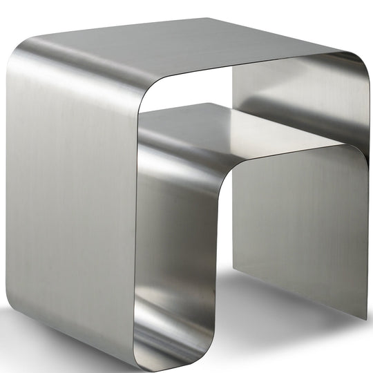 Bauhaus steel side table arc in white background.