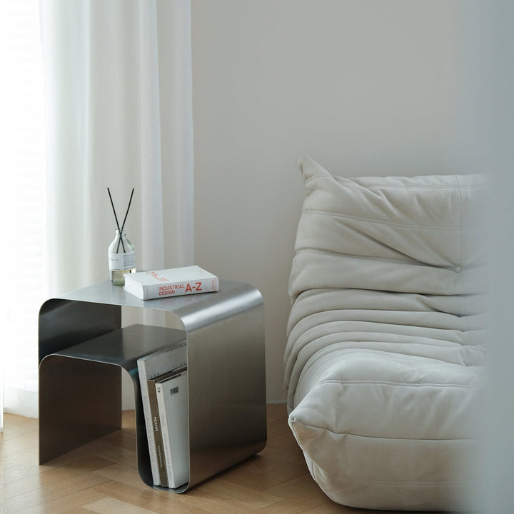 Minimalist steel side table arc in real life style.