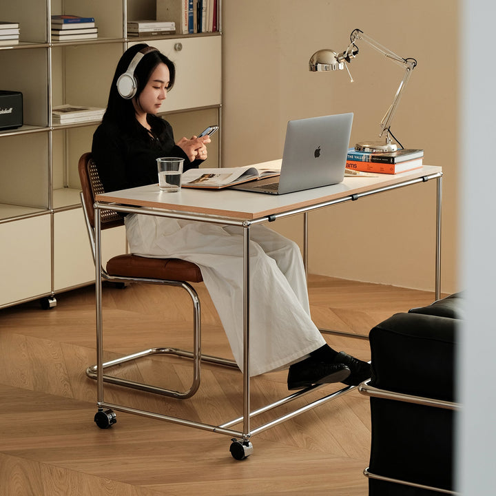 Bauhaus steel wheeled study table usm in panoramic view.
