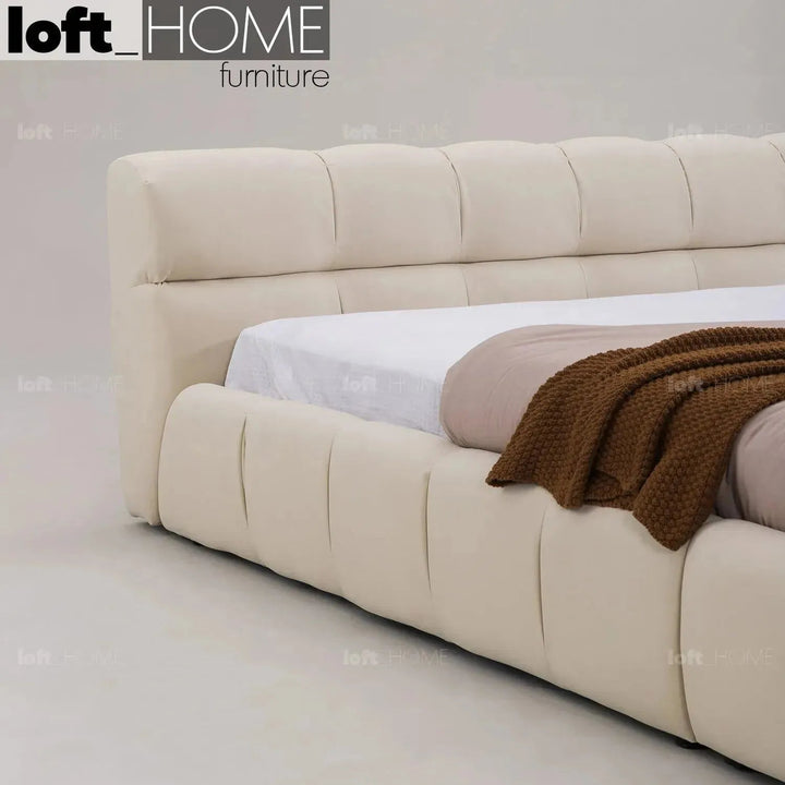 Bauhaus suede fabric bed tufty in still life.