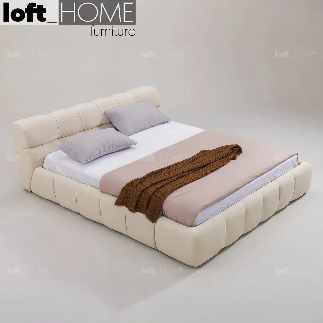Contemporary suede fabric bed tufty with context.