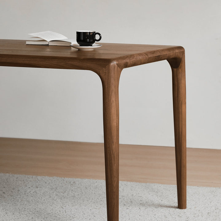 Mininalist walnut wood dining table conti in real life style.