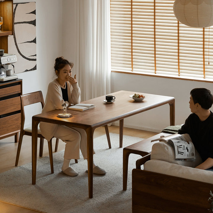 Mininalist walnut wood dining table conti with context.