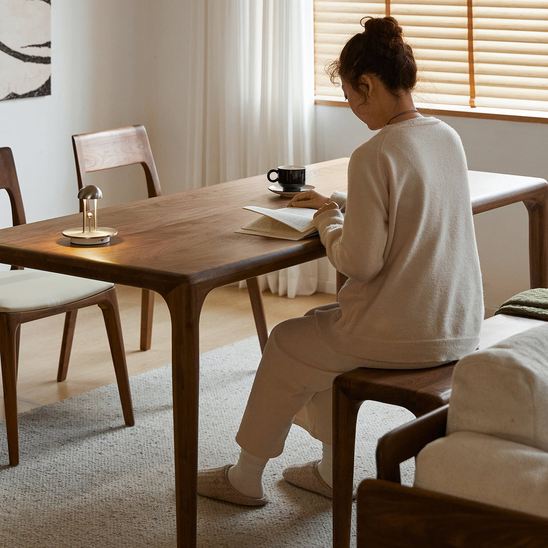 Mininalist walnut wood dining table conti in details.