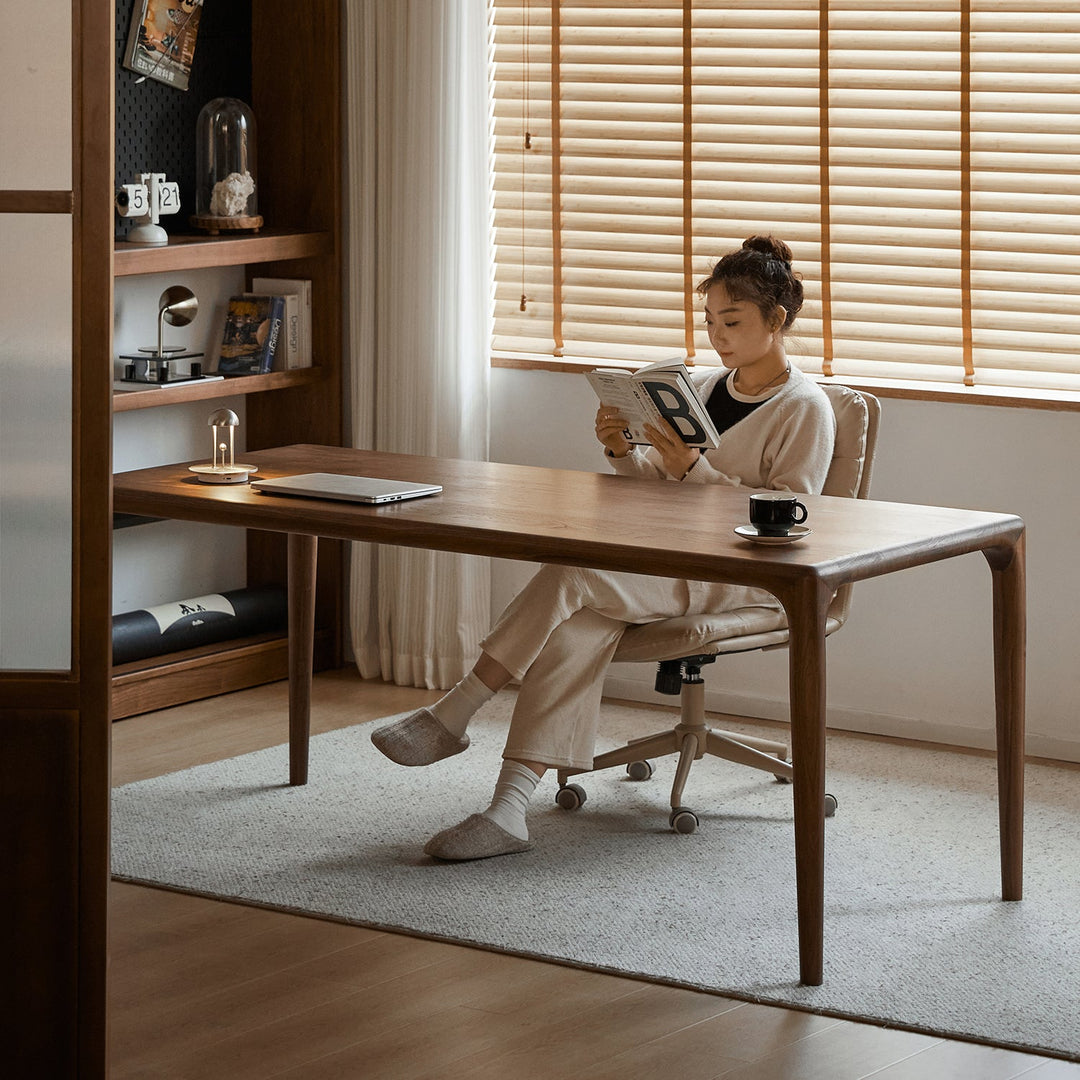 Mininalist walnut wood dining table conti in close up details.