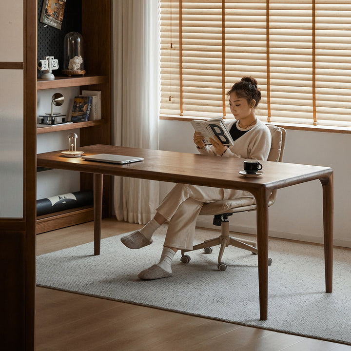 Mininalist walnut wood dining table conti in close up details.