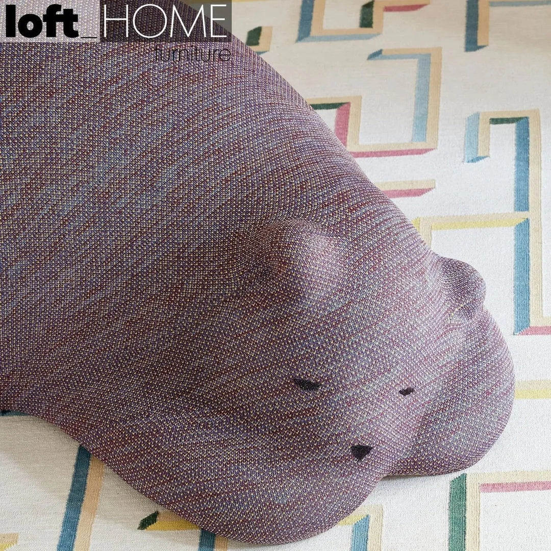 Contemporary knit fabric ottoman resting bear detail 4.