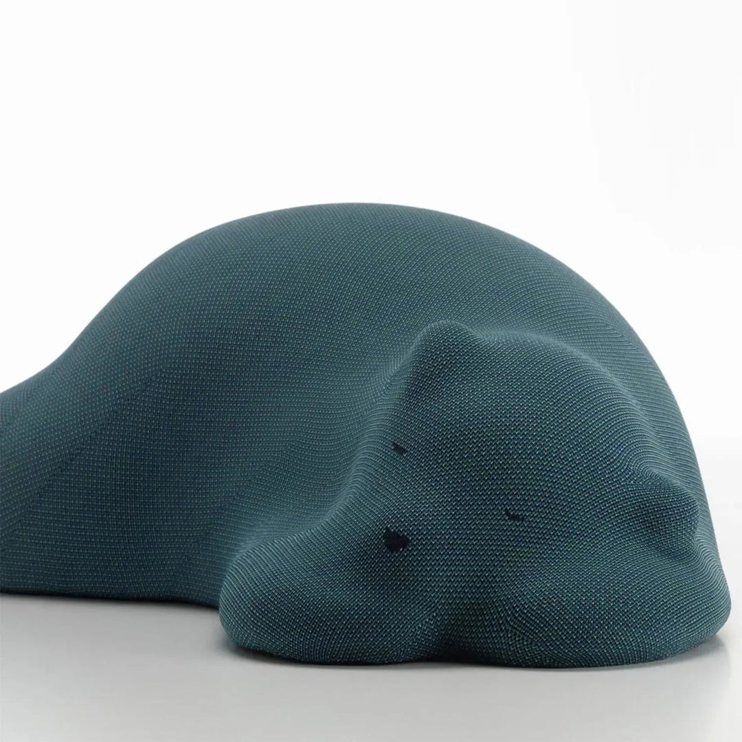 Contemporary knit fabric ottoman resting bear environmental situation.