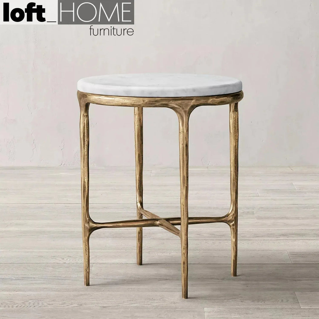 Minimalist marble side table thaddeus round in still life.