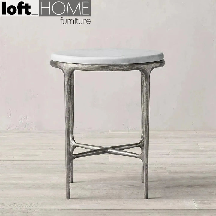 Minimalist marble side table thaddeus round in close up details.