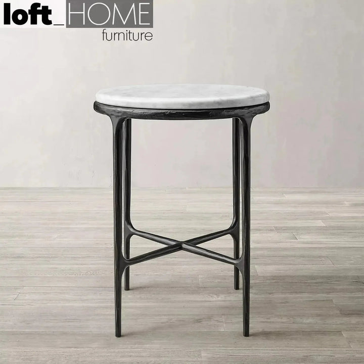Minimalist marble side table thaddeus round in panoramic view.