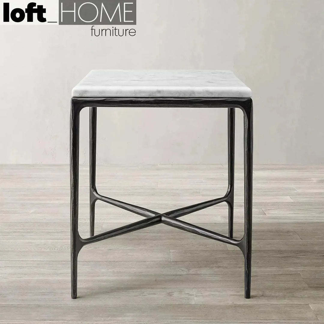 Minimalist marble side table thaddeus square in panoramic view.