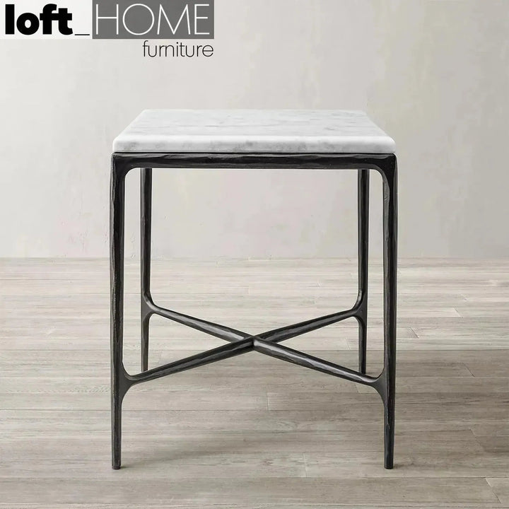 Minimalist marble side table thaddeus square in panoramic view.