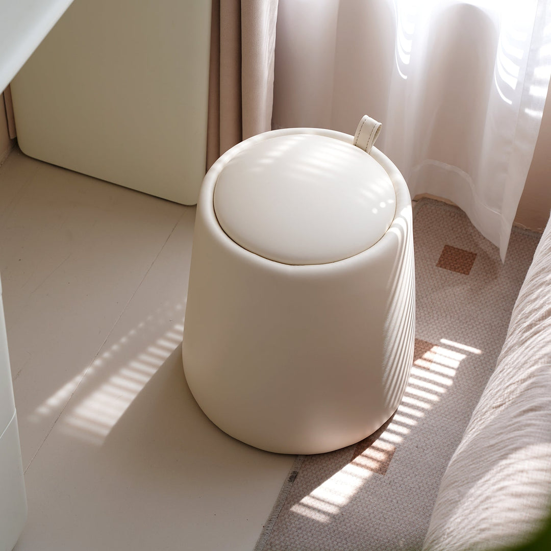 Modern microfiber leather dressing stool pudding in still life.