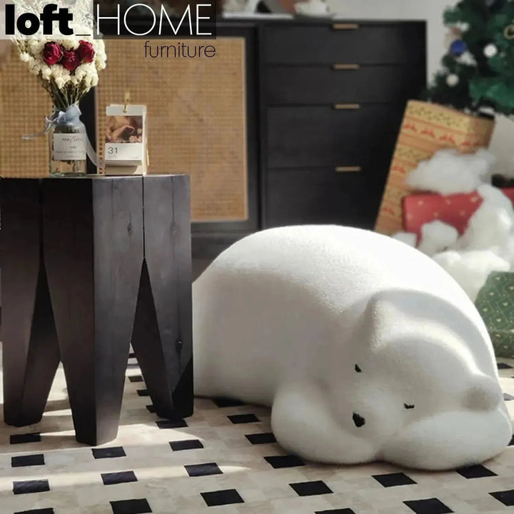 Contemporary velvet ottoman resting bear white conceptual design.